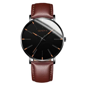 Detail of a stylish men's business watch with black dial and brown leather strap.
