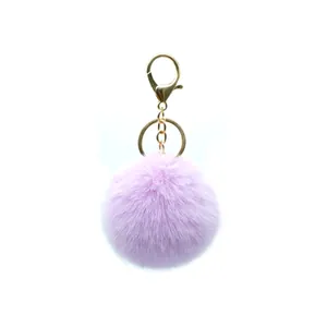 Soft lavender 8cm faux fur pom-pom keychain with gold-tone metal clasp and ring attachment