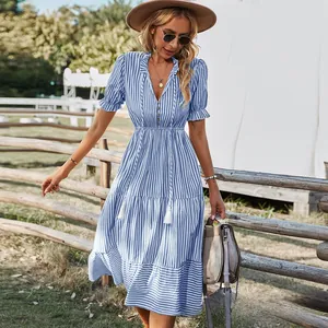 Detailed view of women's blue and white striped V-neck dress with elastic waist