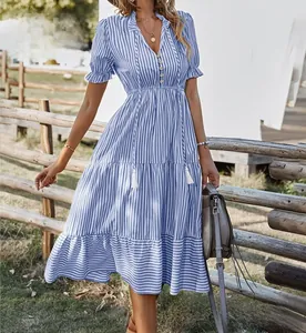 Close-up detail of a blue striped V-neck tiered midi dress with a ruffled sleeve.