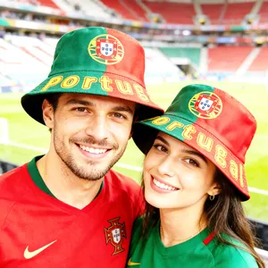 Close-up of fans wearing the Portugal national flag bucket hat in a stadium setting