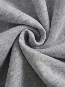 Detailed macro photography showing the soft texture and weave of grey fleece hoodie fabric
