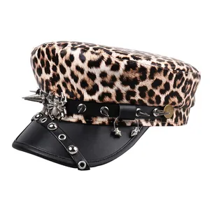 Punk style leopard print flat top hat with silver rivets and spider charm detail.