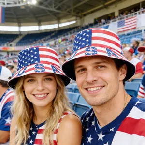 Young smiling couple wearing USA flag bucket hats at a stadium during a sports event