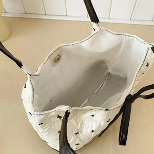 Korean style bow pattern shoulder bag with magnetic closure and black handles