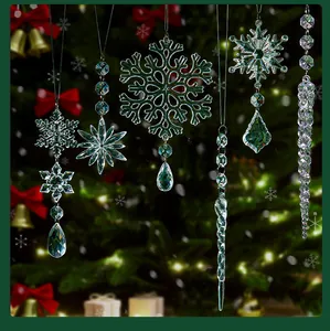 Close-up of clear crystal snowflake and icicle ornaments hanging on a festive Christmas tree.