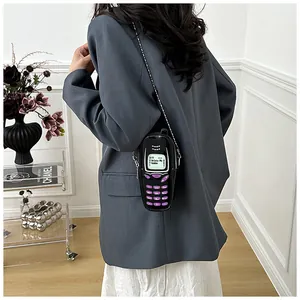 Novelty retro telephone shaped mini crossbody bag for women in lifestyle shot