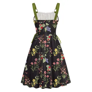 Back view of floral print holiday dress with metal ring straps and fruit pattern