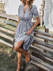 Detailed view of women's blue striped V-neck summer dress with elastic waist