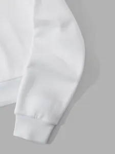 Macro detail of white fleece sweatshirt sleeve showing soft fabric texture and ribbed cuff