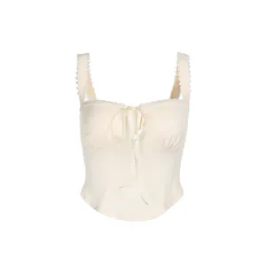 Elegant cream white camisole top with lace trim and decorative ribbon bow for women