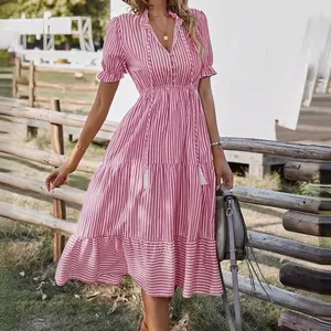 Pink and white striped V-neck dress with elastic waist and ruffle sleeves.