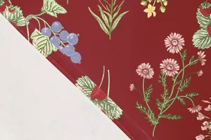 Macro detail showing botanical floral print fabric and high-quality stitching on the hem