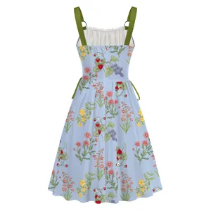 Back view detail showing metal ring straps on light blue floral print vacation dress