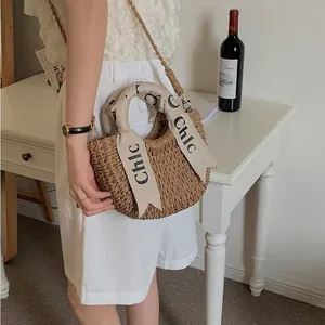 Handmade circular straw woven crossbody bag with scarf handle for beach vacation