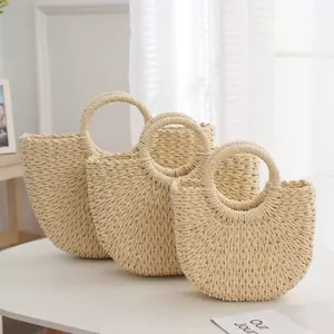 Set of three round handle woven straw beach bags for summer vacation