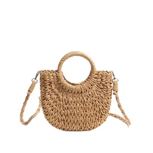 Stylish handmade woven straw crossbody bag with round handle for beach vacations