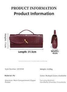 Detailed view of burgundy snake-embossed baguette bag with metal clasp and dimensions