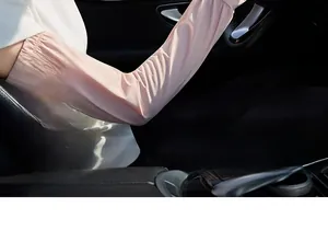 Detail of pink ice silk cooling sun protection arm sleeves with fingerless design for driving.
