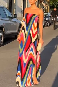 Full-length view of a strapless maxi dress with colorful zigzag patterns and high slit