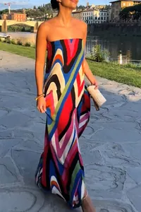 Elegant strapless maxi dress with colorful abstract wave print and high slit detail