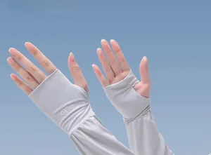Close-up of light grey UV protection ice silk sleeves worn on female hands for driving