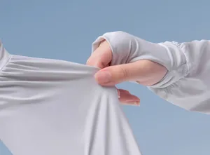 Detail of white cooling sun protection sleeve showing high elasticity and fabric texture