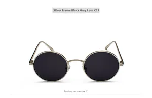 Macro detail of retro round silver frame sunglasses featuring dark grey lenses