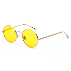 Stylish retro round metal frame sunglasses featuring vibrant yellow lenses for adults.