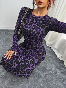 Detailed texture view of purple leopard print mesh fabric on a slim-fit long sleeve maxi dress.