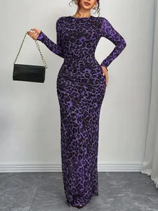 Detail showing the fit and pattern of a purple leopard print slim mesh maxi dress.