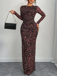 Elegant leopard print mesh long sleeve maxi dress with slim fit and ruched detailing.