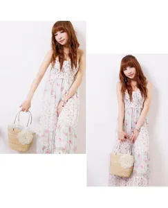 Elegant handmade straw beach bag with floral accent held by a woman in a floral dress.