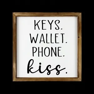 Decorative square wood frame sign featuring 'KEYS. WALLET. PHONE. kiss.' text design