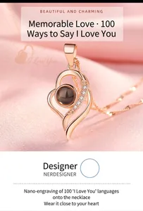 Detailed view of a heart-shaped rose gold projection necklace with 100 languages I love you