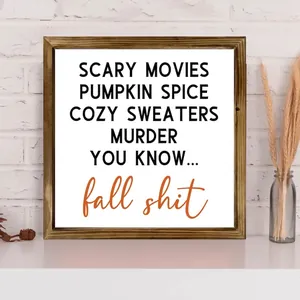 Close-up of a rustic wooden framed fall sign with funny autumn themed typography