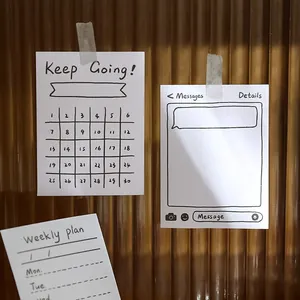 Close-up of minimalist ins-style memo pads with weekly plan and check-in designs