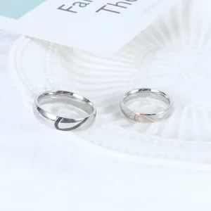 Elegant silver-tone heart stitching couple rings featuring Real Love engraving details