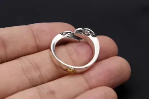 Close-up of S925 sterling silver open ring with intricate eagle head design
