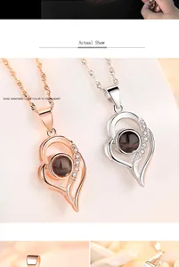 S925 silver heart projection necklace detail showing rose gold and silver variants