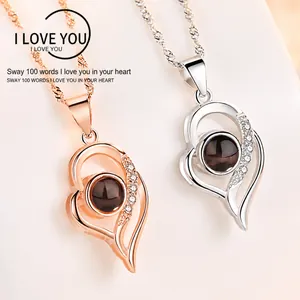 S925 silver heart projection necklace detail showing rose gold and silver variants