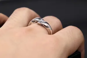 Detailed view of S925 silver eagle ring featuring intricate feather carvings in Thai style.