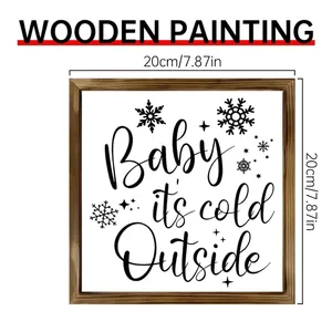 Close-up detail of 20x20cm wooden frame wall decor with Baby it's cold outside text
