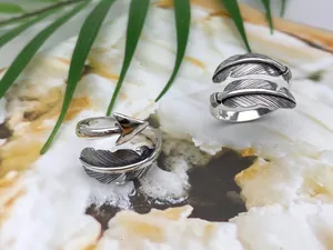 Detailed view of S925 sterling silver feather and arrow open rings in Thai silver style