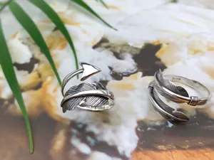 Macro detail of S925 sterling silver feather and arrow vintage Thai silver open rings
