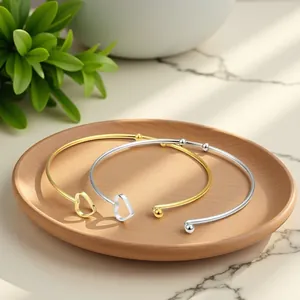 Minimalist stainless steel heart open cuff bracelet set in polished gold and silver finish