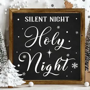 Detail of wooden frame Christmas sign with 'Silent Night Holy Night' text.