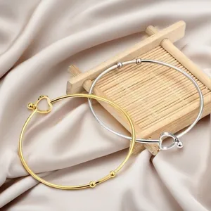 Minimalist stainless steel open bangles with heart-shaped clasp in gold and silver
