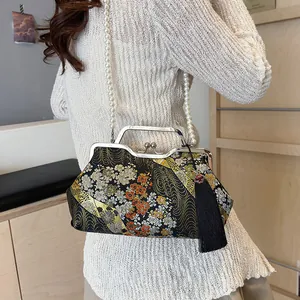 Elegant Chinese style floral embroidered handbag with pearl chain and black tassel