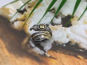 Detailed macro view of S925 sterling silver feather open ring with vintage Thai silver finish